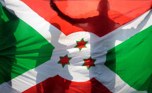 Waving Flag Of Burundi With Shadows Wallpaper