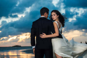 Wedding Couple Beach And Clouds Wallpaper