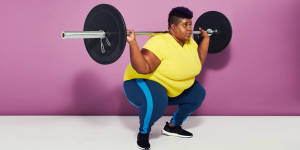 Weight Lifting Barbell On Woman's Shoulders Wallpaper