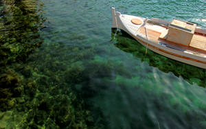 White Boat Drifting On Green Water Wallpaper