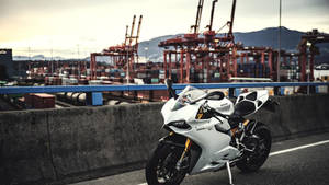 White Ducati At Container Port Wallpaper
