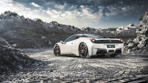 White Ferrari On Rocky Road Wallpaper