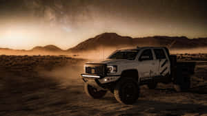 White Lifted Truck In The Dessert Wallpaper