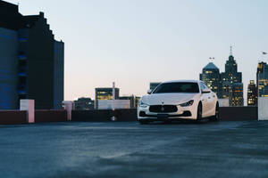 White Maserati And Cityscape Wallpaper
