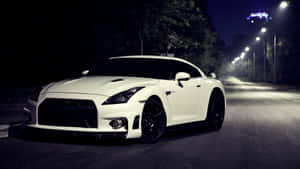 White Nissan R35 Gtr On The Road Wallpaper