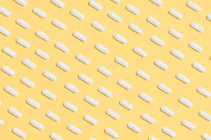 White Pills On A 4k Tablet Wallpaper