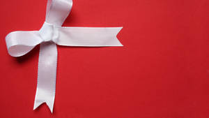 White Ribbon On Red Christmas Background Wallpaper