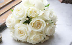 White Roses In A Bouquet On A Table Wallpaper