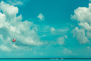 Wide Shot Of Person Parasailing Wallpaper