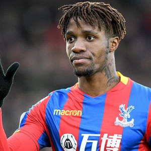 Wilfried Zaha Flaunts His Unique Hairstyle In A Casual Fashion Wallpaper