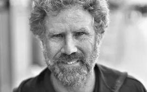 Will Ferrell Striking A Stylish Pose In A Suit Wallpaper