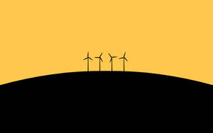 Wind Turbines On A Hill With A Yellow Background Wallpaper