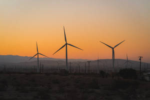 Windmills During Sunset Screensavers Wallpaper