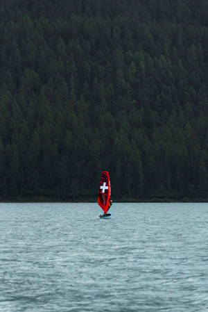 Windsurfing Sail With A Cross Wallpaper