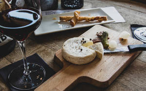 Wine And Cheese On Table Wallpaper