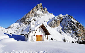 Winter House In Rocky Mountains Wallpaper