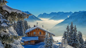Winter House In Sea Of Clouds Wallpaper