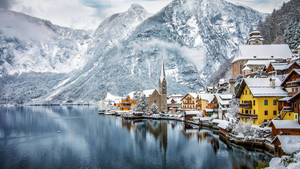 Winter_ Lakeside_ Village_ Snowy_ Mountains.jpg Wallpaper