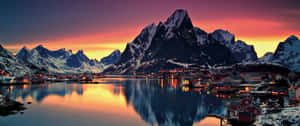 Winter View Of A Lonely Tree In Front Of The Snow-covered Mountains. Wallpaper