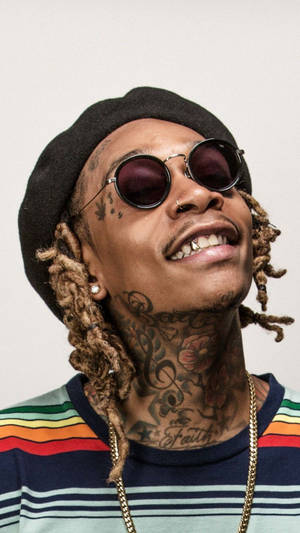 Wiz Khalifa Showcasing Iconic Dreadlocks Wallpaper