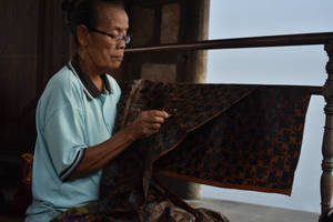 Woman Holding Batik Wallpaper