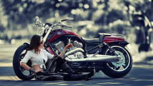 Woman Leaningon Classic Motorcycle Outdoors Wallpaper