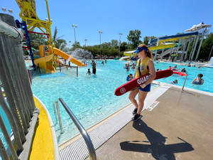 Woman Lifeguard Guarding The Poolside Wallpaper