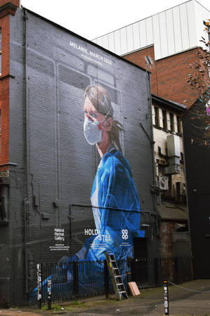 Woman Nurse Building Street Art Wallpaper