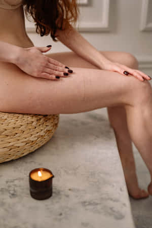 Woman Rubbing Thigh In Bathroom Wallpaper