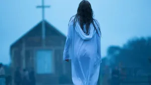 Woman Walking Towards Church Foggy Backdrop Wallpaper