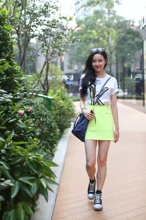 Woman Wearing Yellow Miniskirt Wallpaper