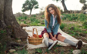 Woman With Curly Hair On Picnic Wallpaper