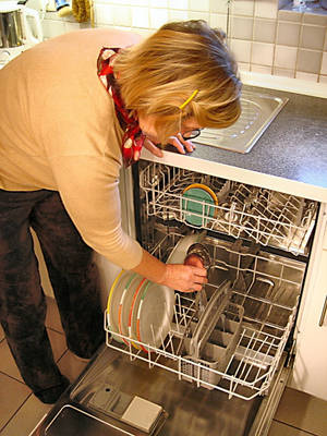 Woman With Dishwasher House Cleaning Wallpaper