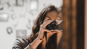 Woman With Film Camera Wallpaper