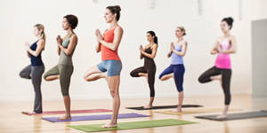 Women In Yoga Stance Wallpaper