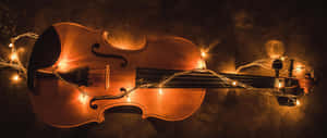 Wooden Chordophone Violin Instrument With Fairy Lights Wallpaper