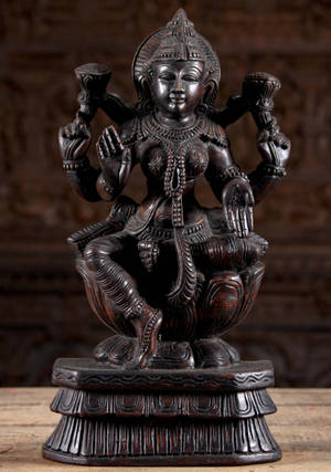 Wooden Lakshmi Devi Figurine Wallpaper