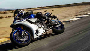 Yamaha Sportbike Speeding Desert Road Wallpaper