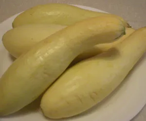 Yellow Squash Fruits On A White Plate Wallpaper