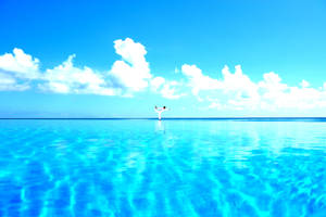 Yoga Above Blue Water Wallpaper