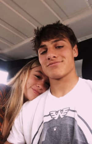 Young Couple Enjoying A Romantic Moment Together Wallpaper