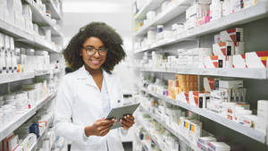 Young Female Pharmacist Wallpaper