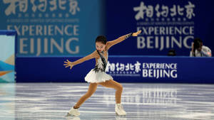 Young Female Skater At Winter Olympics Wallpaper