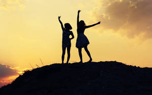 Young Girl Best Friends On Cliff Wallpaper