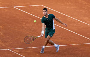 Young Tennis Prodigy - Carlos Alcaraz In Action Wallpaper