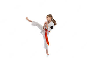 Young Women Executing A Side Kick In Taekwondo Wallpaper