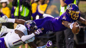 Zay Jones Diving Holding The Ball Wallpaper