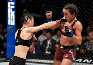 Zhang Weili Punching Joanna Jędrzejczyk Wallpaper