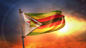Zimbabwe Flag Against Sunset Wallpaper