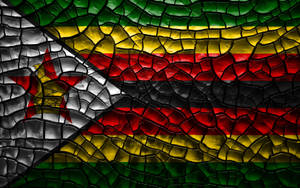 Zimbabwe's Flag On Cracked Soil Wallpaper